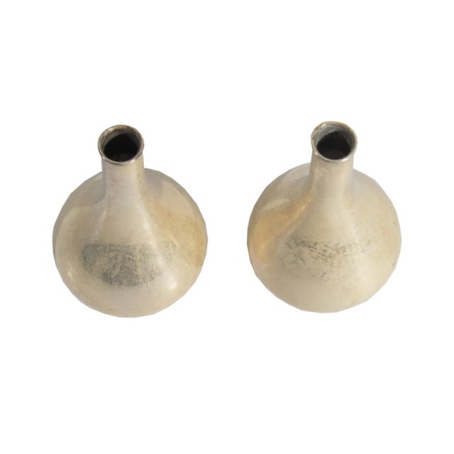 A pair of silverplate teardrop candlestick holders designed by Danish designer Jens Harald Quistgaard (1919-2008) for...