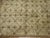 A Vintage Turkish rug with an all-over floral design in neutral tones 6'' x 7'6''