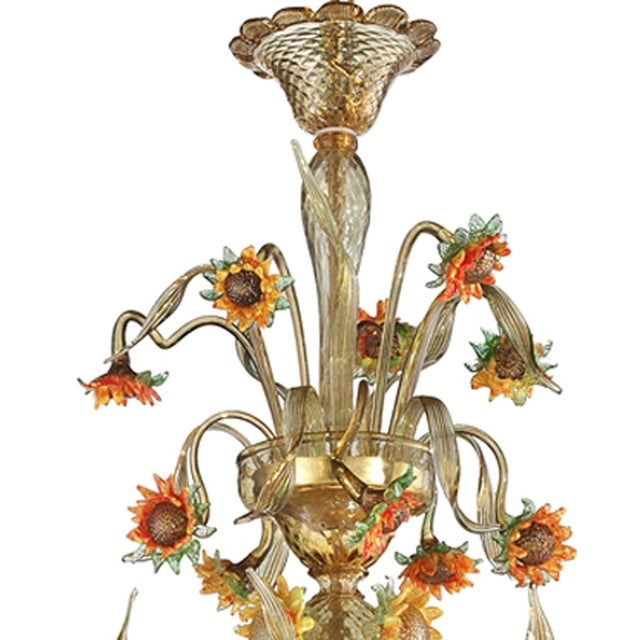 Venetian floreal chandelier made in amber and green Murano glass with sunflowers in yellow and orange paste. Full of...