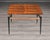 This Italian cocktail table features a square top veneered in rosewood, composed of eight panels laid to radiate...
