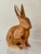 Two wooden rabbits with a lime wash finish. Unmarked but attributed to Sarreid Ltd. of Spain. Measurements: Larger rabbit...