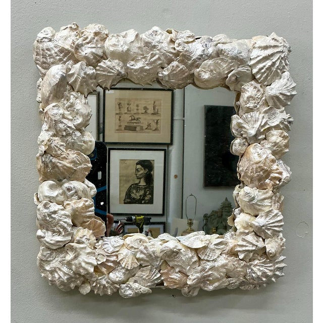 Pretty white “pearly” shell frame mirror for your powder room.
