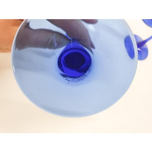 About this item Small wine or liquor glasses with a blue stem. Marked at the bottom This piece is attributed to the...