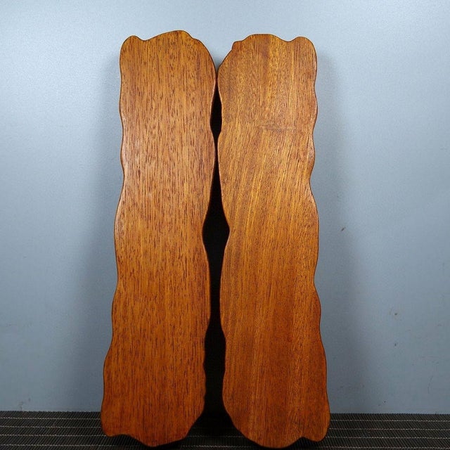 Add a touch of natural elegance to your desk or collection with this exquisite pair of carved wooden paperweights. Crafted...