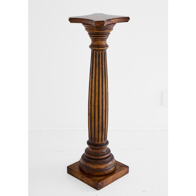 A 20th Century handsome and well-proportioned Spanish display pedestal or torchere plant stand in walnut, formed as a...