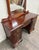 This is a vintage Thomasville mahogany vanity and dressing table with an ornate adjustable mirror. Designed in the...