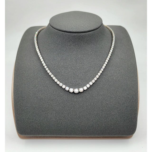 This exquisite natural diamond necklace features a stunning array of 125 round white diamonds, exuding a modern elegance....