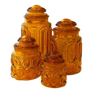 1960s Mid-Century Modern Le Smith Moon & Star Amber Glass Cannister Graduated in Size Cottage - Set of 4 For Sale