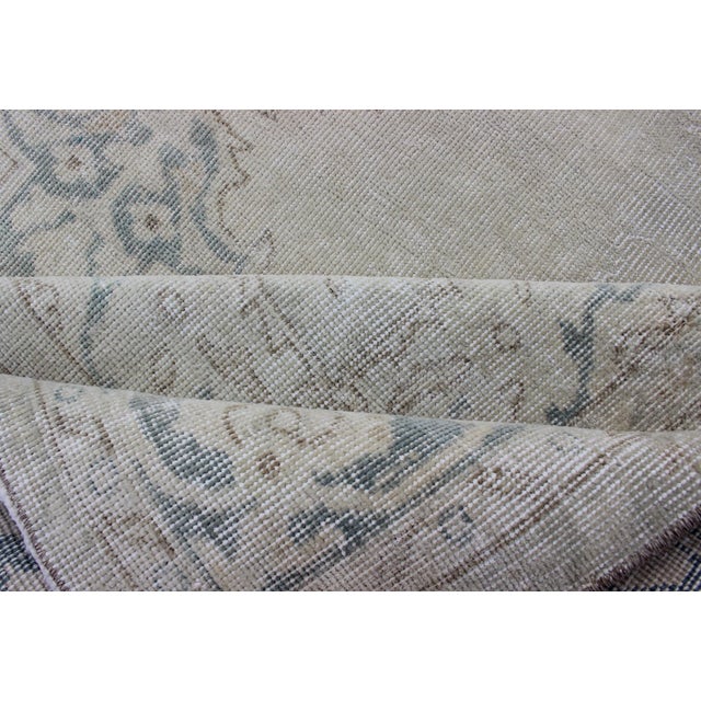 Medallion Distressed Oushak Turkey in Cream, Blue Tones, Brown and Teal Blue For Sale - Image 14 of 15