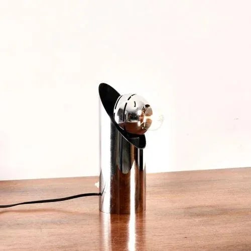 Chrome Angelo Lelli (Lelii) table lamp produced by Arredoluce around 1969. This early edition has a diameter of 9 cm and a...