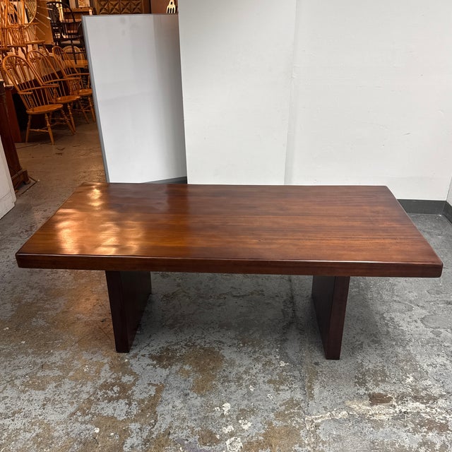 Design Plus Gallery presents a Contemporary Rectangular Double Pedestal Dining Table. This dining table showcases a broad...