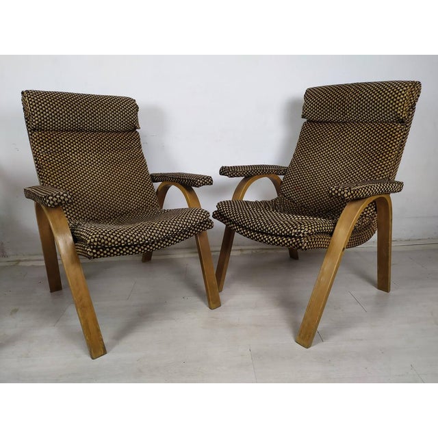 Set of Bow Wood Armchairs from Baumann, 1970s, in Worn conditions. Designed 1970 to 1979 This piece has an attribution...