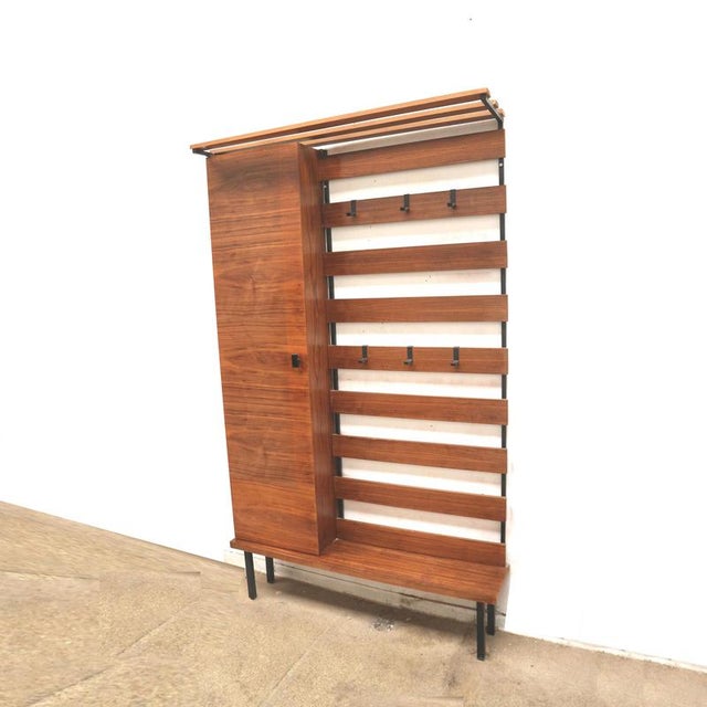 Vintage hallway cabinet with coat rack and shoe cabinet from the 1960s. Authentic vintage hallway cabinet from the 1960s...