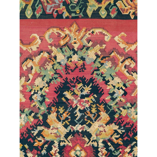 A vintage Russian Bessarabian flat-woven rug from the mid-20th century. Measures: 6' 10" x 7' 2"