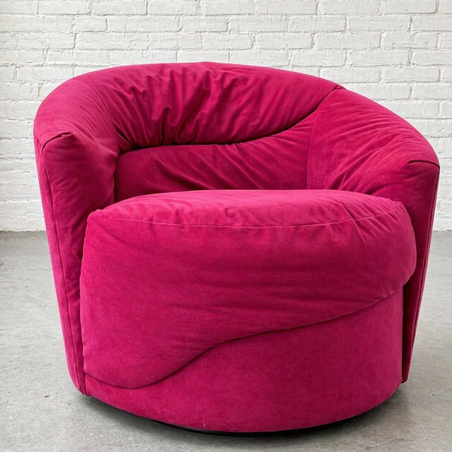 A striking blend of Postmodern and Mid Century Modern design, this Vladimir Kagan styled swivel lounge chair features bold...