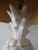 Vintage, white glazed ceramic lamp with natural fiber 'starter' shade. Lamp base has three parts forming the complete...
