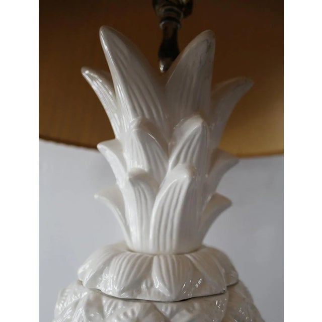Vintage, white glazed ceramic lamp with natural fiber 'starter' shade. Lamp base has three parts forming the complete...