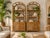 Beautiful pair of vintage Palm Beach Regency rattan étagères featuring elegant arched tops, intricate geometric and a warm...