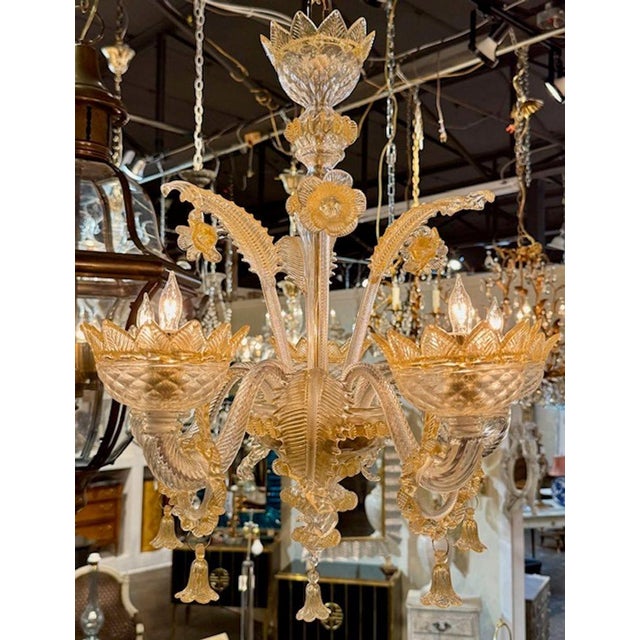 Gorgeous Murano amber and clear glass Venetian style 5 light chandelier. Each of these chandeliers is handmade in Murano,...