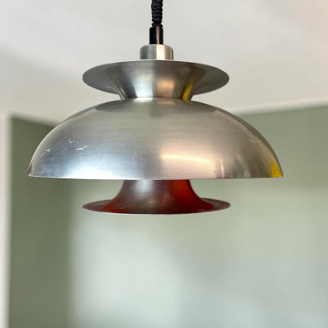 Large vintage mid-century modern pendant light from the 1970s, featuring an adjustable rise-and-fall mechanism that allows...