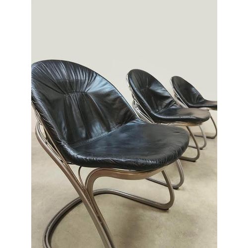 This set of 3 vintage dining chairs is a design by Gastone Rinaldi. Country of origin: Italy. The underside of the...