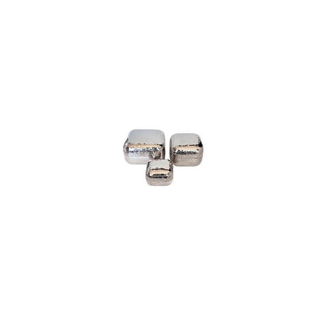This exquisite set of three Mid-Century Modern nesting boxes brings a sleek, sculptural elegance to any surface. Crafted...