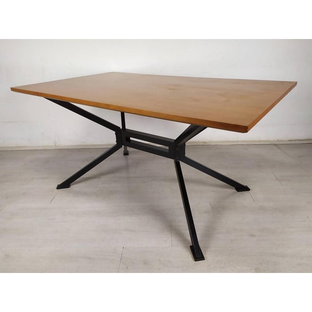 Metal and Teak Table from Roche Bobois, 1980s, in Good conditions. Designed 1980 to 1989 This piece has an attribution...
