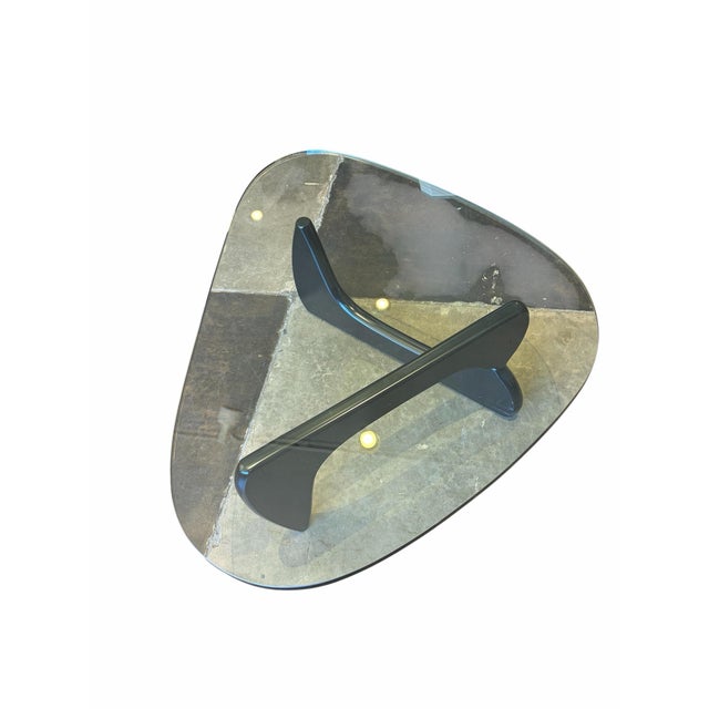 An authentic mid-century modern icon, this Herman Miller Isamu Noguchi Coffee Table features a heavy, soft-triangle glass...