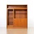 This vintage mid-century china cabinet/bookcase was produced by Denmark during the 1960s. Made from teak, this minimalist...