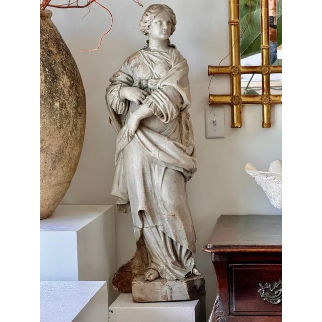 Late 18th Century carved, off-white polychrome French statue of St. Barbara, the inspiration for Rapunzel.