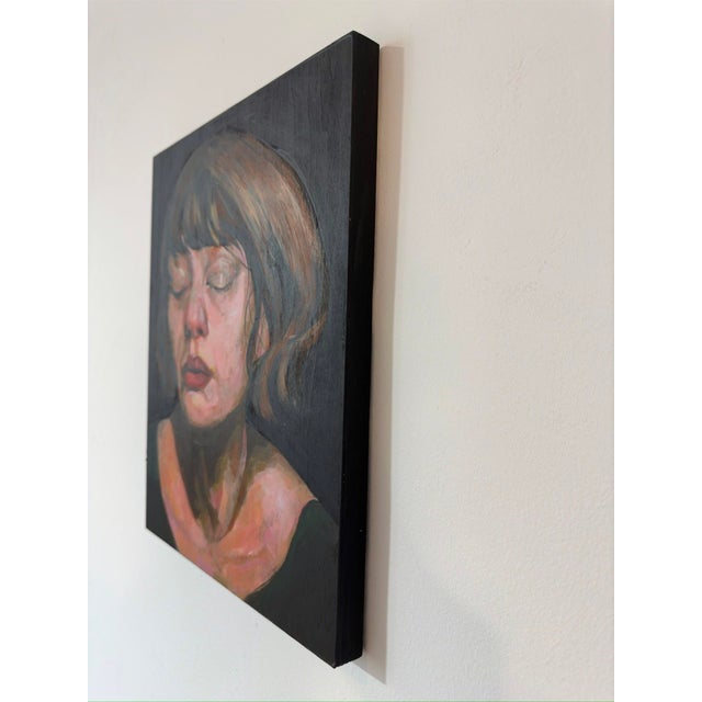 This oil painting on wood captures a moment of introspection, featuring a figure with closed eyes and a serene expression....