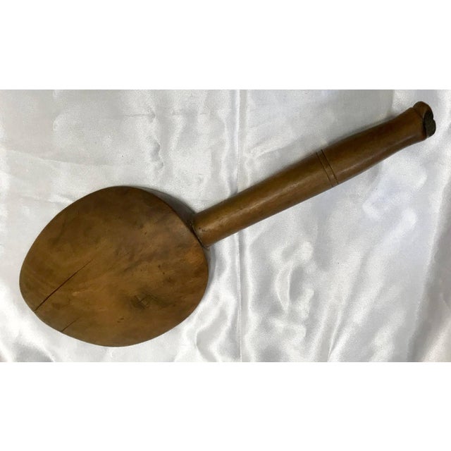 You can tell by the wear to the wooden spoon edge that this utensil has stirred many pots. Even the handle is worn from...