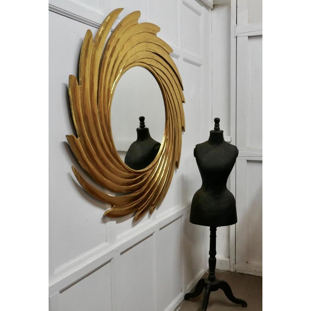 Huge carved sunburst swirl gilt mirror A superb piece, made in the last century, the usual sunburst frame which is 12”...