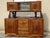 Large and beautiful solid walnut sideboard with mustache-shaped legs and simple, straight curves. Lower section: pyramidal...