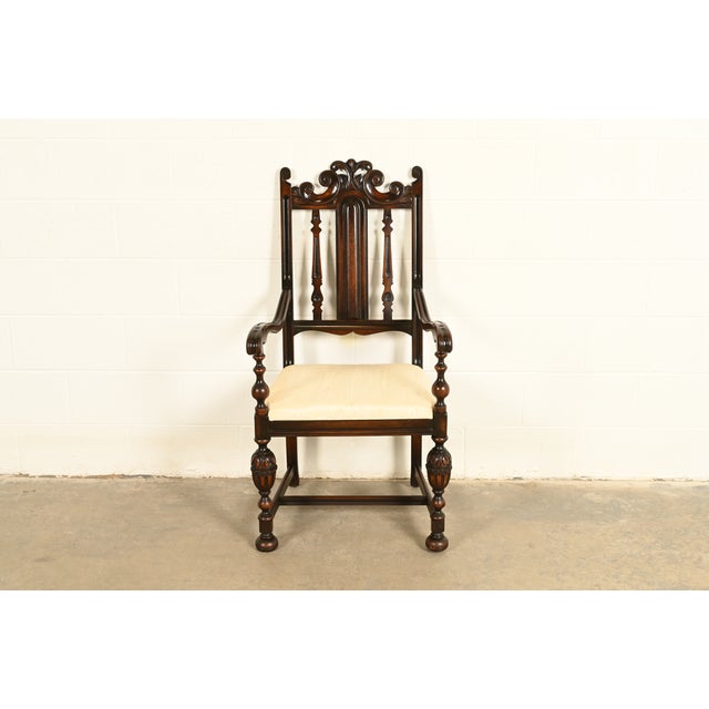 A beautiful antique English Jacobean or Tudor style armchair or dining captain chair By Berkey & Gay USA, Circa 1920s...