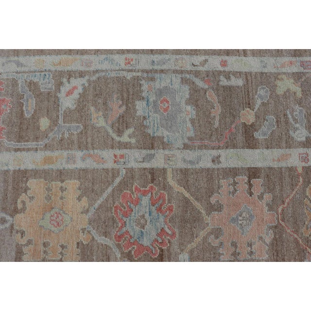 Brown Turkish Oushak Rug With All-Over Floral Design on a Light Brown Field For Sale - Image 8 of 12
