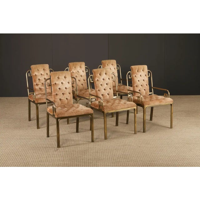An elegant and sought after set of six dining chairs by Mastercraft, crafted in the 1970s and featuring the iconic Greek...
