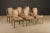 An elegant and sought after set of six dining chairs by Mastercraft, crafted in the 1970s and featuring the iconic Greek...