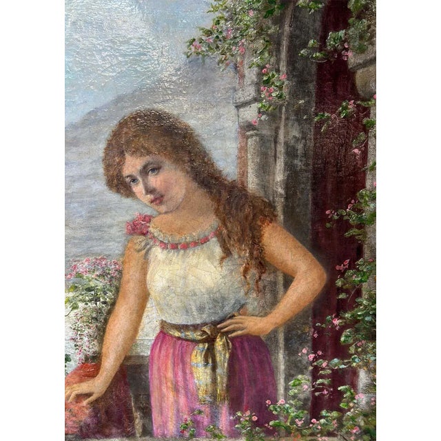 Antique oil on canvas portrait on a hand-carved giltwood frame, depicting a beautiful red-head young lady standing...