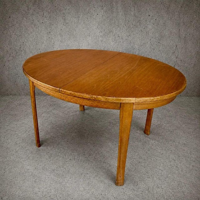 A beautifully proportioned mid-century extending dining table by the renowned British manufacturer Sutcliffe of Todmorden,...