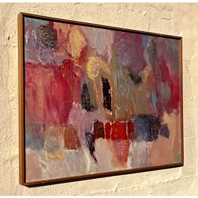 This vintage modern abstract signed oil painting on canvas exudes a vibrant and dynamic energy that will captivate any art...