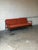 Featuring sculpted wooden armrests and an open spindle back frame, this three-seat sofa showcases architectural lines. In...