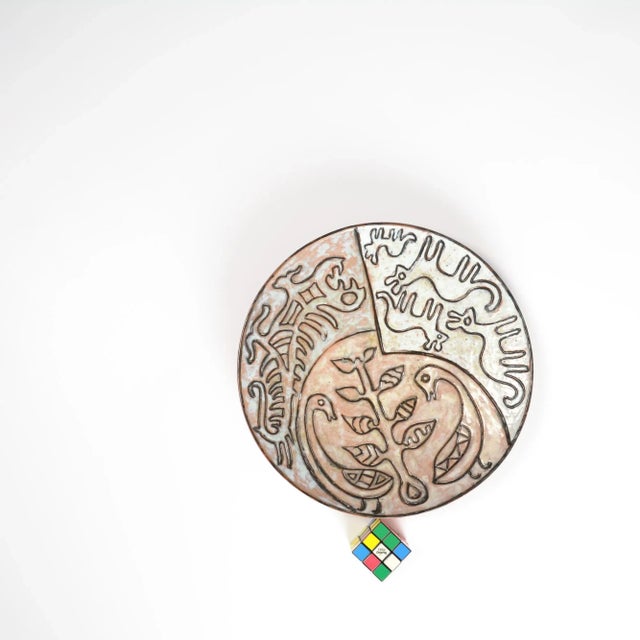 This black and white ceramic hand-painted plate can be dated in the 1950s. The pure line drawings of stylized fantasy...