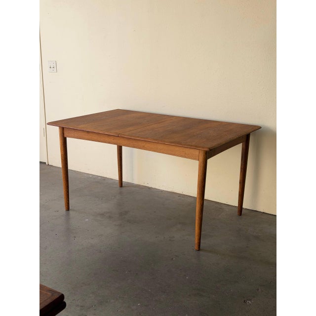 Authentic Mid-Century Modern Danish oak dining table, produced in Denmark circa 1960s This beautifully crafted...