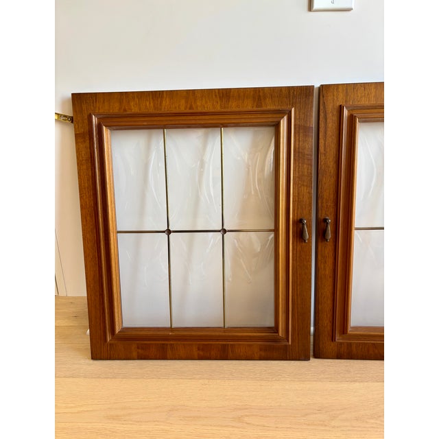 Beautiful pair of walnut wood and leaded glass cabinet door from the early 70s. Made in Germany they were part of a very...