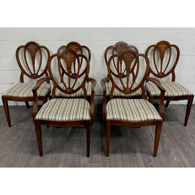 This is a stunning complete set of six vintage Hepplewhite or Georgian style shield back dining chairs, including two arm...
