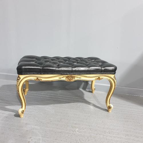 Very good original painted long stool with black leather deep buttoned top, in overall excellent condition. Height:17.5 in...