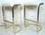 Mid-Century Modern stools with polished brass frame and white seats. (Please confirm item location - NY or NJ - with dealer).