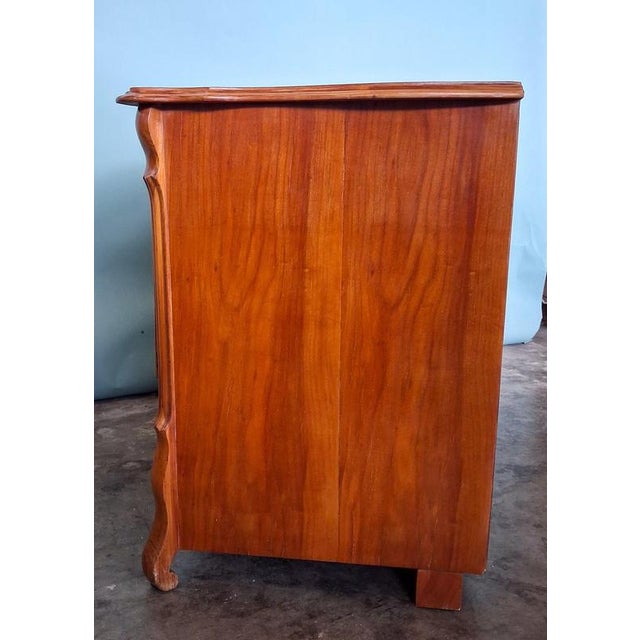 Elegant antique Biedermeier chest of drawers from France with beautiful cherry wood veneer and a classic three-drawer...