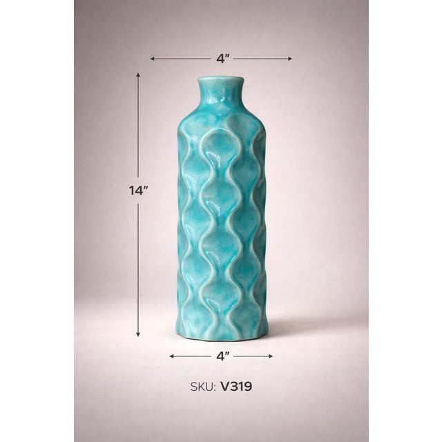 ✨ A striking Coastal Breeze statement vase featuring a sculptural wavy form and richly layered turquoise crackle glaze,...